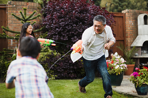 Father and kids playing